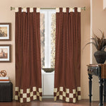 Brown sari tab top curtains hung at a window