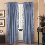 Silver sari rod pocket curtains hung at a window