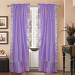 Lavender sari rod pocket curtains hung at a window