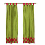 Olive green sari tab top curtains hung at a window
