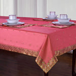 Peach sari tablecloth laid on a dining table