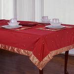 Maroon sari tablecloth laid on a dining table