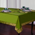 Forest green sari tablecloth laid on a dining table
