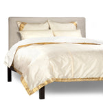 Cream sari duvet cover set made up on a bed