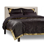 Black sari duvet cover set made up on a bed