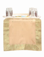 Gold silk table runner running down a dining table