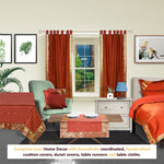 Rust sari tab top curtains hung at a window