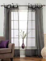 Sheer tissue tie top curtains hung at a window