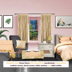 Golden sari tab top curtains hung at a window