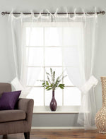 Sheer tissue tie top curtains hung at a window