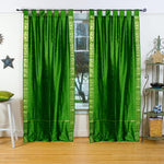 Forest green sari tab top curtains hung at a window