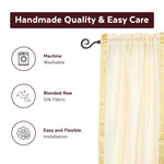 Cream sari rod pocket curtains hung at a window