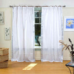 Silver sari tie top curtains hung at a window