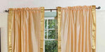 Gold sari rod pocket curtains hung at a window