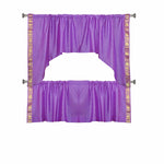 Lavender sari curtains hung at a window