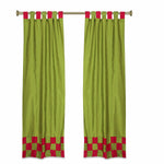 Olive green sari tab top curtains hung at a window