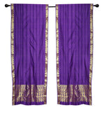 Purple sari rod pocket curtains hung at a window