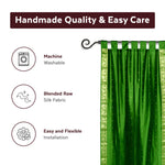 Forest green sari tab top curtains hung at a window