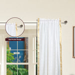 White sari rod pocket curtains hung at a window