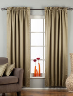 Olive green sari rod pocket curtains hung at a window