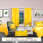 Yellow sari rod pocket curtains hung at a window