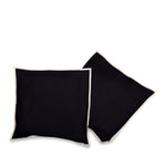 Cream raw silk cushion covers arranged on a sofa
