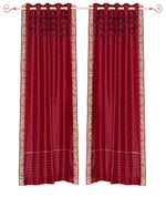 Fire brick sari grommet top curtains hung at a window