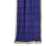 Cream sari tab top curtains hung at a window