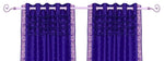 Purple sari grommet top curtains hung at a window