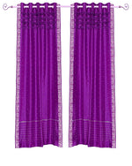 Violet sari grommet top curtains hung at a window