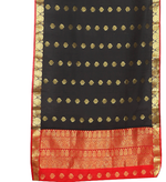 Black sari rod pocket curtains hung at a window