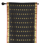 Black sari rod pocket curtains hung at a window