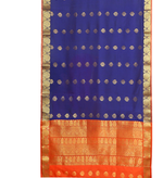 Blue sari rod pocket curtains hung at a window
