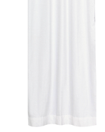 Purple velvet ring top curtains hung at a window
