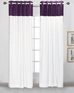 Purple velvet ring top curtains hung at a window
