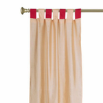 Gold sari tab top curtains hung at a window