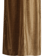 Taupe velvet ring top curtains hung at a window