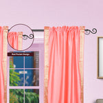 Pink sari rod pocket curtains hung at a window
