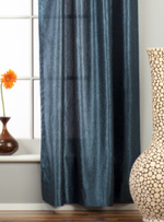 Navy blue sari tab top curtains hung at a window