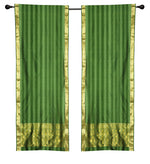 Green sari rod pocket curtains hung at a window