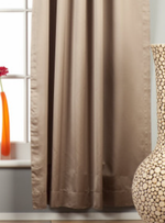 Gray sari rod pocket curtains hung at a window