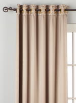 Gray sari grommet top curtains hung at a window