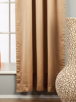Taupe sari tab top curtains hung at a window