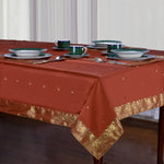 Rust sari tablecloth laid on a dining table