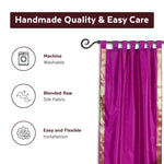 Violet sari tab top curtains hung at a window