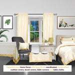 Cream sari rod pocket curtains hung at a window