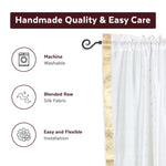 White sari rod pocket curtains hung at a window