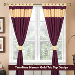 Maroon raw silk tab top curtains hung at a window