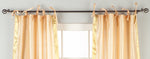 Misty rose sari tie top curtains hung at a window