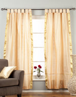 Misty rose sari tab top curtains hung at a window